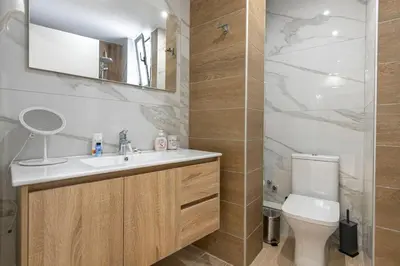 a bathroom with a sink and a toilet at Nikiou 11 in Athens