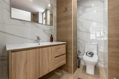 a bathroom with a sink and a toilet at Nikiou 11 in Athens