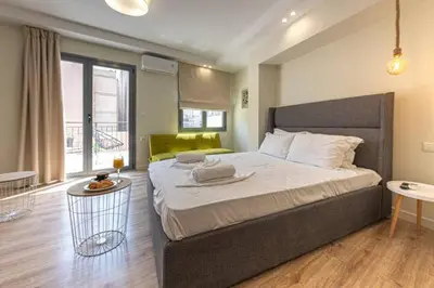 a bedroom with a large bed in a room at Nikiou 11 in Athens
