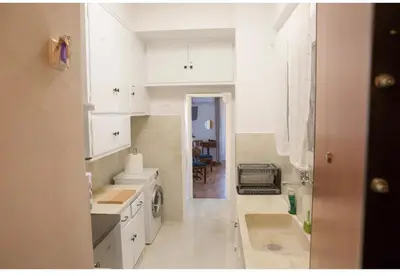 a white kitchen with a sink and a dishwasher at Athens view suite in Athens