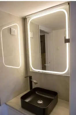 a bathroom with a black sink and a mirror at Athens view suite in Athens