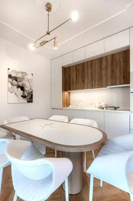 a kitchen and dining room with a table and chairs at Stylish acropolis view apartment in Athens