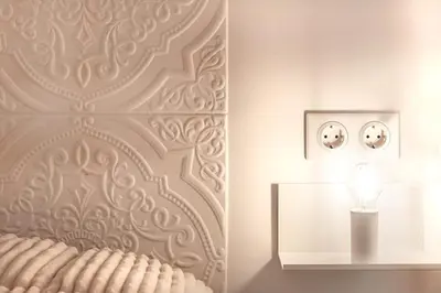 a room with a vase and a lamp on a wall at Stylish acropolis view apartment in Athens