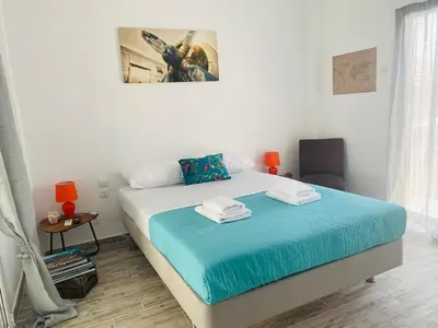 a bedroom with a bed with two towels on it at Acropolis Penthouse - 100Mbps Internet Connection in Athens