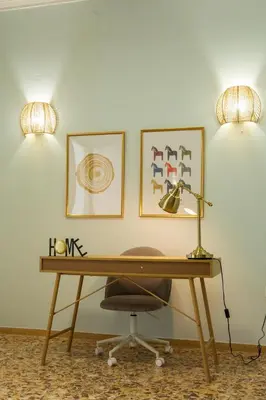 a desk with a lamp and a chair at Antigonis Athenian Home in Athens