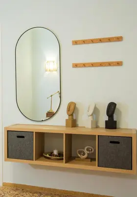 a mirror on top of a wooden shelf at Antigonis Athenian Home in Athens