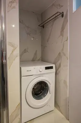 a washer and dryer in a small bathroom at Antigonis Athenian Home in Athens