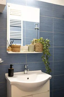 a bathroom with a sink and a mirror at Athens Imperial in Athens