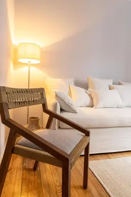 a living room with a couch and a table at Athens Imperial in Athens