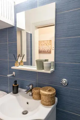 a bathroom with a sink and a mirror at Athens Imperial in Athens