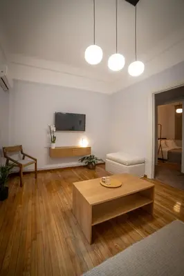 a living room with a coffee table and a couch at Athens Imperial in Athens