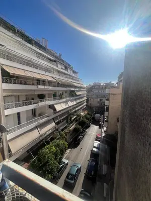 a view of a street with cars parked in a parking lot at Authentic Kypseli 1 Bedroom in Athens