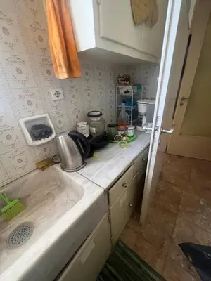 a kitchen with a sink and a counter top at Authentic Kypseli 1 Bedroom in Athens