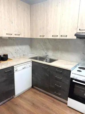 a kitchen with a sink and a stove at Acropolis Traditional Stoney Retreat in Athens