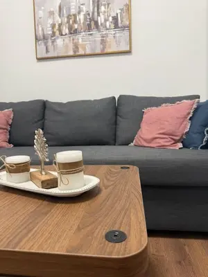 a coffee table in a living room with a couch at Acropolis Traditional Stoney Retreat in Athens