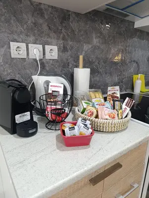 a counter with a table with some food on it at Studio 35 - Modern & Cozy Studio in Chalandri City Center in Athens