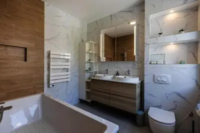 a bathroom with a tub and a sink and a toilet at Koukaki Vibe in Athens