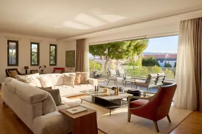 a living room with a couch and a table at Villa Riviera in Vari