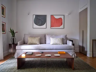 a living room with a couch and a coffee table at 12ve Plaka, a Chic Apartment in the Heart of Plaka in Athens
