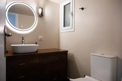 a bathroom with a sink and a mirror at Navarino Athenian Nest in Athens