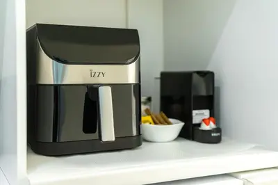 a coffee maker is sitting on a shelf at Urban Patio Apartment in Athens