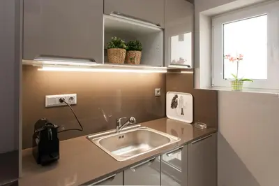 a kitchen with a sink and a window at Modern Comfort 2 bdrm Apartment in Voula in Athens