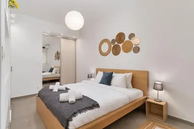 a bedroom with a large bed with two pillows at Urban Nest - Studio, Neos Kosmos in Athens