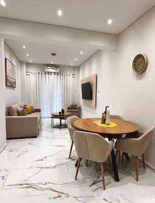 a living room with a table and chairs at Cozy Apartment in Central Athens in Athens