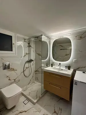 a bathroom with a shower and a toilet and a sink at Cozy Apartment in Central Athens in Athens