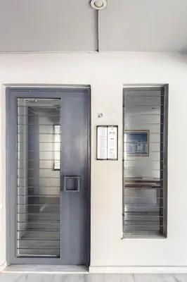 two elevators on the side of a building at Acropolis Sky Retreat Jacuzzi & 3BR Maisonette in Athens