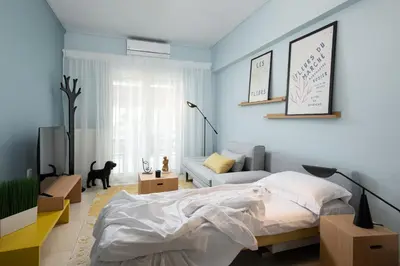 a bedroom with a bed and a couch at Sea and City Voula Suite by First Class Properties in Athens