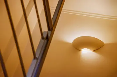 a light on the ceiling of a room at Athens Riviera Luxury Voula Residence in Athens