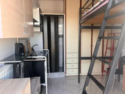 a kitchen with a loft bed in a room at Terrace View Studio in Athens