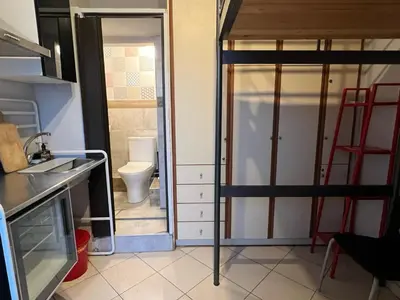 a bathroom with a toilet and a door in a room at Terrace View Studio in Athens