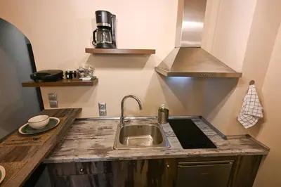 a kitchen with a sink and a counter top at Kallithea Cozy Stonewall Studios in Athens