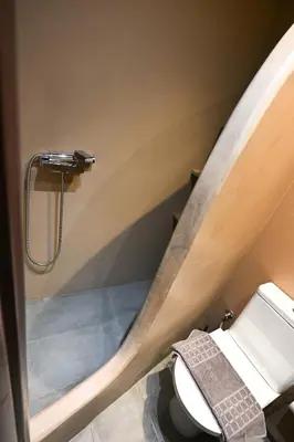 a bathroom with a toilet and a shower at Kallithea Cozy Stonewall Studios in Athens