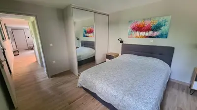 a bedroom with a bed and a mirror at Stella House near Metropolitan & Holargos Metro Station in Athens