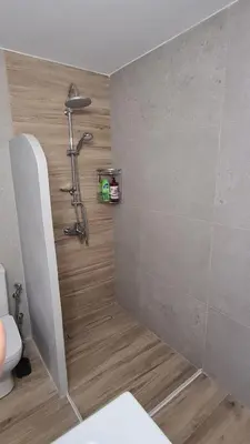 a bathroom with a shower and a toilet at Stella House near Metropolitan & Holargos Metro Station in Athens
