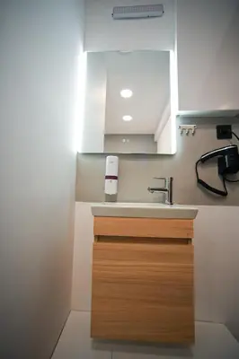 a kitchen with a sink and a mirror at Evaggelistrias 22 Suite by Zeus Suites in Athens