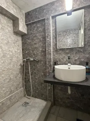 a bathroom with a sink and a mirror at Athens Center Museum in Athens
