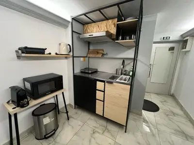 a small kitchen with a sink and a microwave at Athens Center Museum in Athens