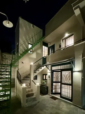 a house with a staircase and a stair case at AVLI Central Athens Hideaway Walk to All Attractions in Athens