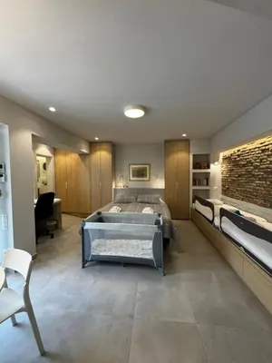 a large bedroom with a bed and a couch at AVLI Central Athens Hideaway Walk to All Attractions in Athens