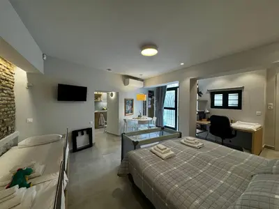 a bedroom with a bed and a desk in it at AVLI Central Athens Hideaway Walk to All Attractions in Athens