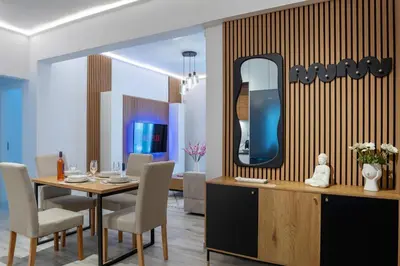a dining room with a table and a mirror at Oasis Residence Athens in Athens
