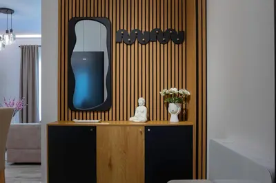 a room with a mirror on a wall with a table at Oasis Residence Athens in Athens