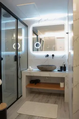 a bathroom with a sink and a mirror at Oasis Residence Athens in Athens