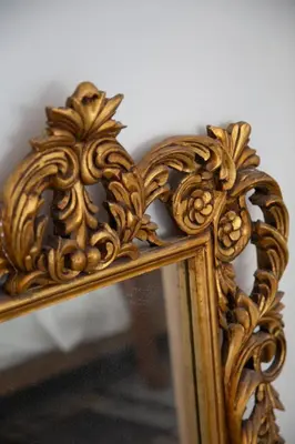a mirror with a gold frame with a reflection in it at Central Urban Retreat in Athens