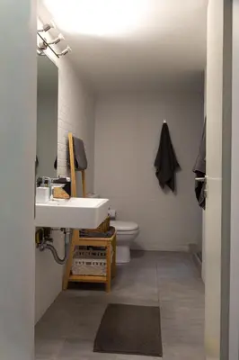 a bathroom with a sink and a toilet at Central Urban Retreat in Athens