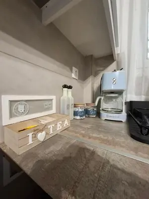 a kitchen with a counter top with a toaster oven and a counter sidx sidx at Iliana's Retreat by Greece Apartments in Athens
